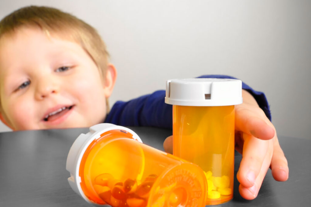 Child reaching for pill bottles